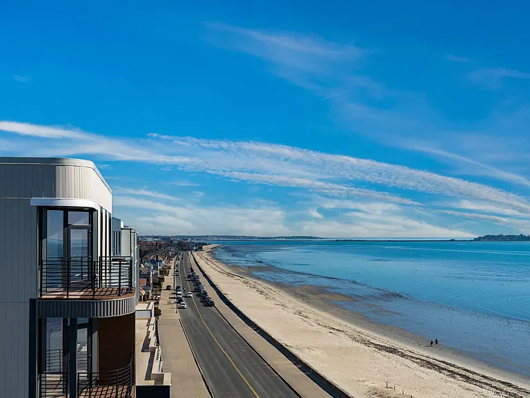 Sweeping shoreline views paired with a coastal setting just outside your door.