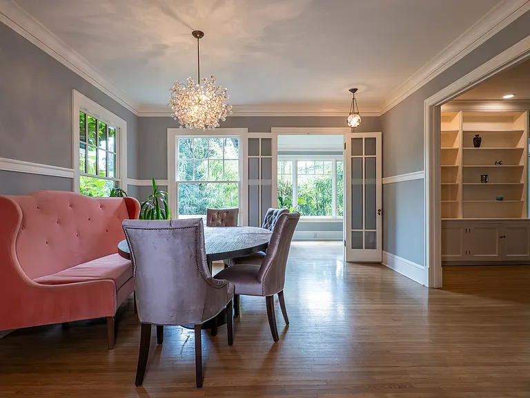 Dining room with cozy banquette and gorgeous lighting.