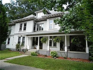 Home is built of brick-like concrete block, and sits on a poured concrete foundation - very unusual, solid, and low maintenance for an 1880 home! House faces both Middle and Cross Drives.
