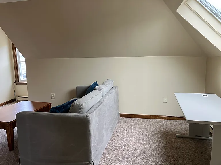 Office/computer area with large. Chair coming.