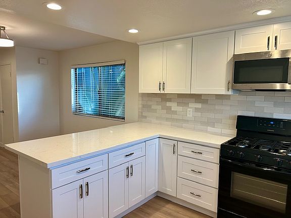 New cabinets, counter tops, flooring. Great spacious kitchen