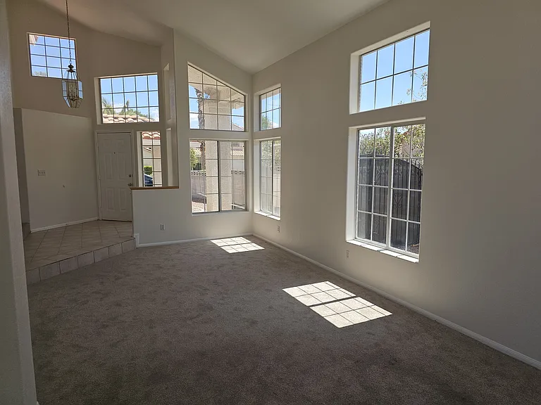 Natural light floods the area through strategically placed windows, highlighting the vaulted ceiling