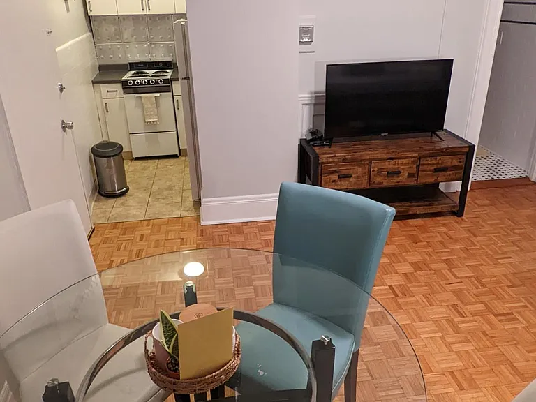 Living area and kitchen, furniture and TV included