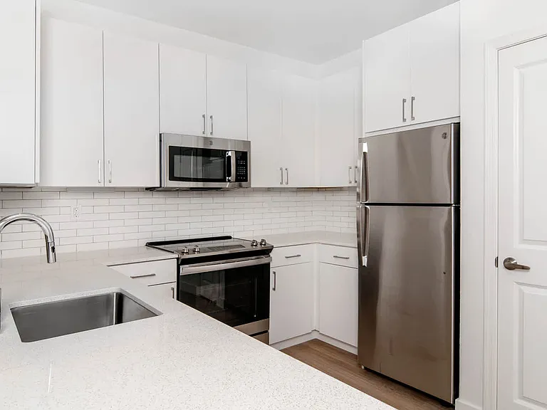 Kitchen with Quartz Countertops and Stainless Steel Appliances