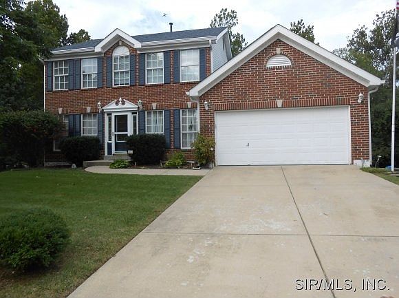 Front with a long driveway