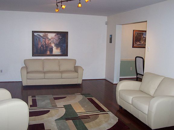 Formal Living Room w/ Wood Flooring