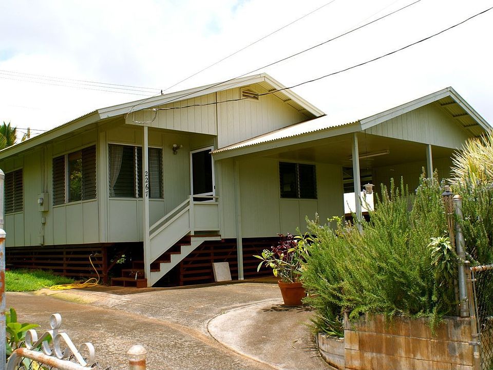 Home viewed from street. Yard completely fenced.