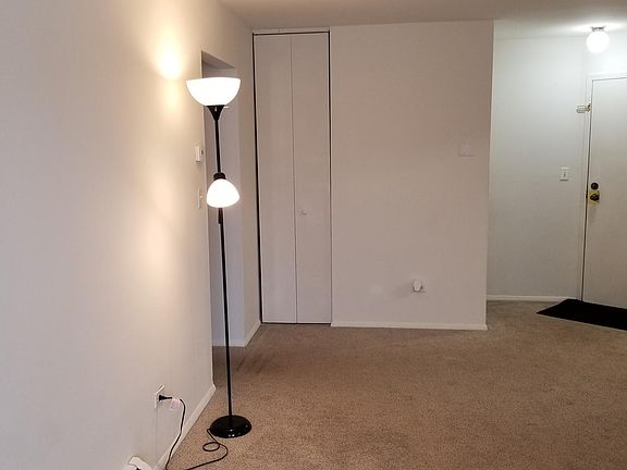 Living Room with Condo Entrance, Entry closets and entry to bedrooms and bathrooms.