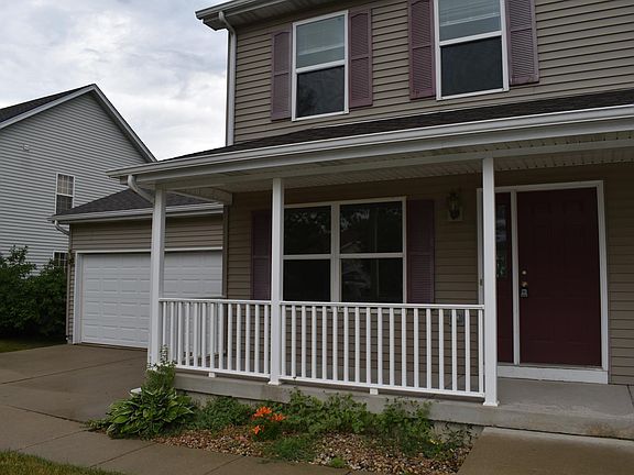 Front porch and attached 2 car garage