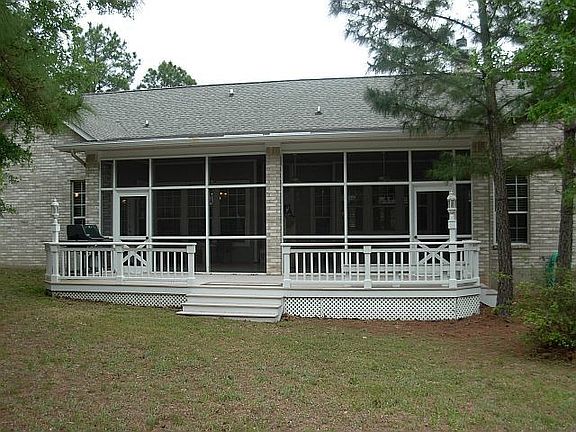View of rear deck and screened in porch