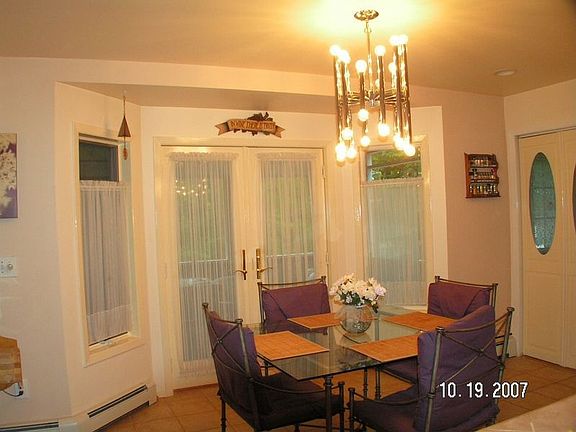 French doors to enclosed porch