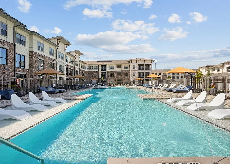 Salt-Water Pool - Resort-style pool with sun shelf, cabanas and grills for relaxing and entertaining close to home.