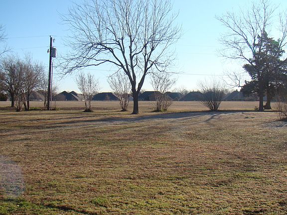 5 acres with several fruit producing trees surrounding the property. 