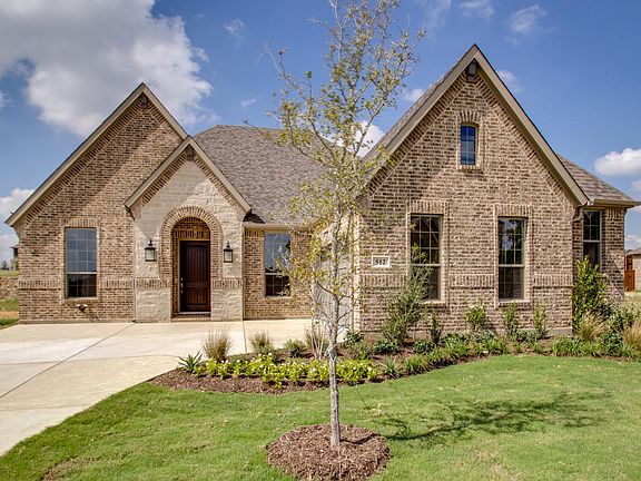 custom one-story brick and stone home