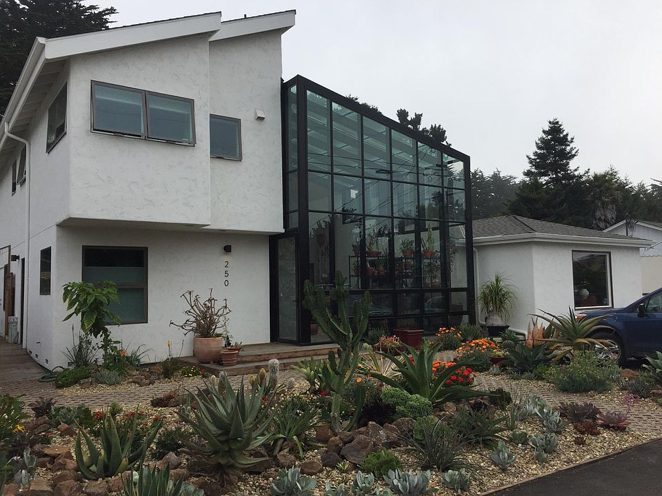 The apartment is on the upper left, with views of both front and back gardens. It has a private entry.