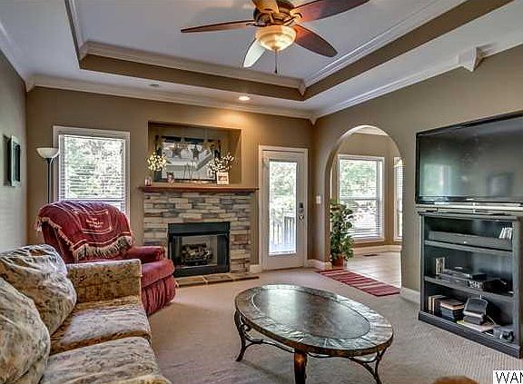 Family room has gas log fireplace