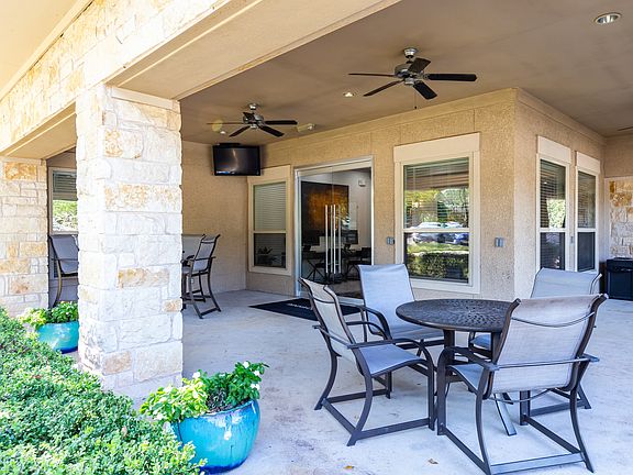 Entertain poolside with an outdoor grilling area and dine al fresco