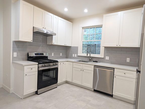 Brand new remodeled kitchen with new appliances, including dishwasher