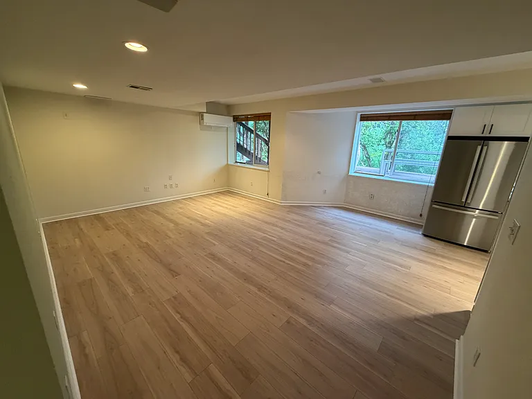Living room with south facing garden level windows