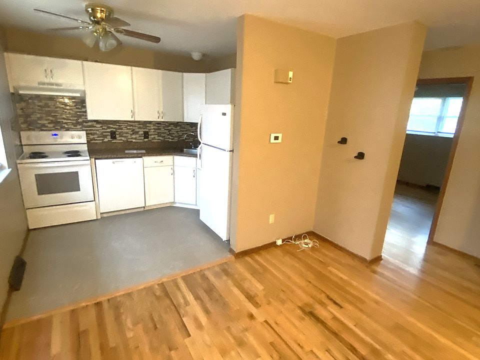 View of living room and kitchen with new hardwood flooring!