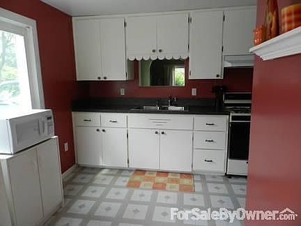 Kitchen
						:
						Pass-through window looks out to dining area and living room
