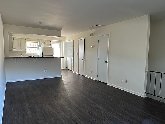 upstairs living room, open kitchen, breakfast area.