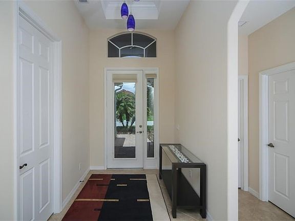 Entry: tray ceiling, drop down lights and ceramic tile on diagional.