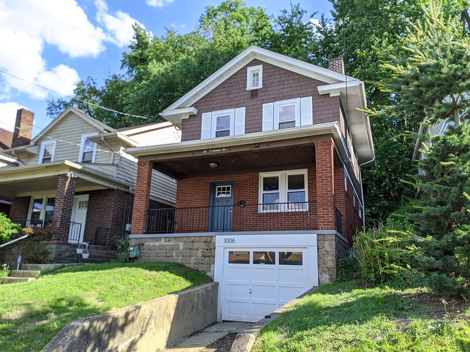 Front porch, front yard, and garage/driveway