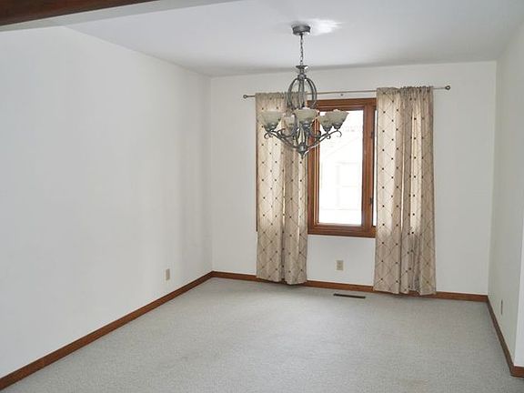 The formal dining room is located between the Kitchen and the formal living room.  Easy to serve for special entertaining events.  The window overlooks the backyard.