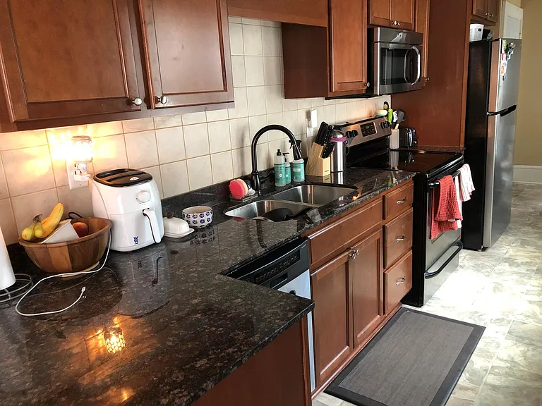 Kitchen with dishwasher, microwave, stainless appliances, granite counter top with under mount dual sinks. Plenty of cabinet space.