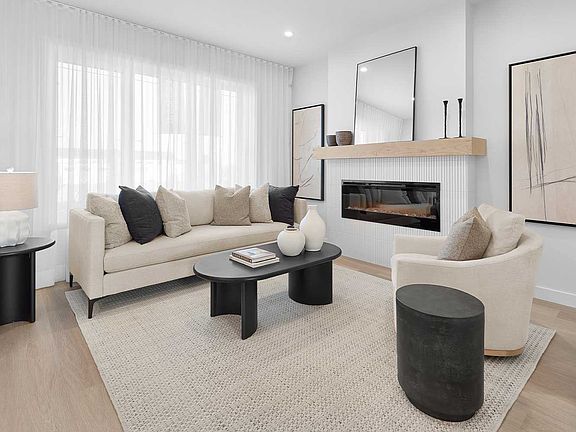 Experience warmth and sophistication in this inviting great room, designed for both relaxation and s