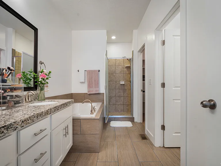 Primary bathroom with big soaker tub and shower.