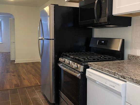 New appliances, fridge, stove, and dishwasher.