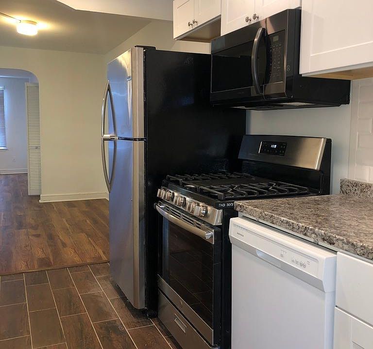 New appliances, fridge, stove, and dishwasher.