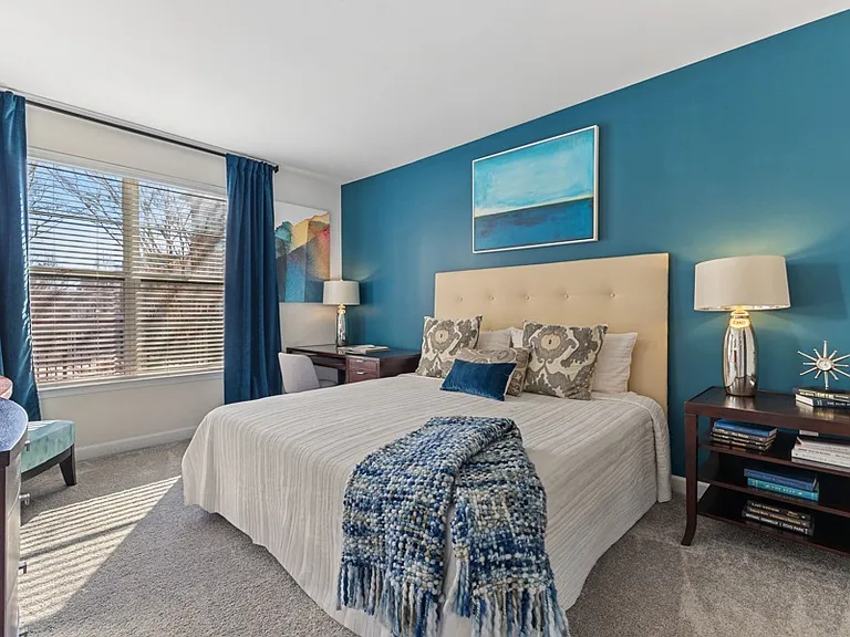 Plush carpeting with padding in bedrooms along with 2' plantation blinds