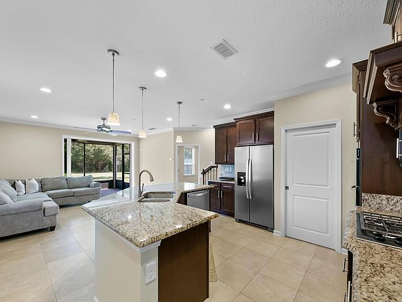 Open Plan Kitchen to Family Room and Lanai