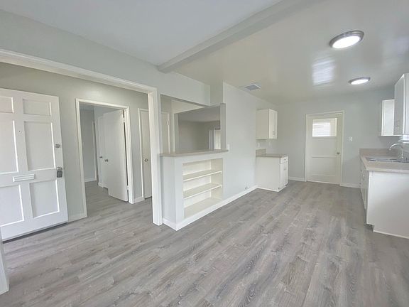 Aha! The kitchen _ you could pack the whole family dinner prep team in here! Stove is on it_s way, and will be placed next to the left cabinet _ fridge goes on the other side of that cabinet - concurrent access, but not in the way!