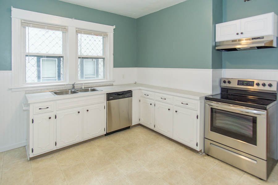 Large kitchen with brand new stainless appliances.