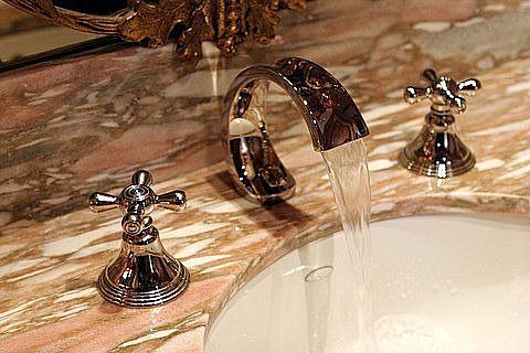Custom fixtures & stone work in all baths