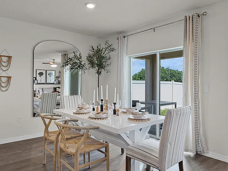 Stylish dining area with natural light and patio access.