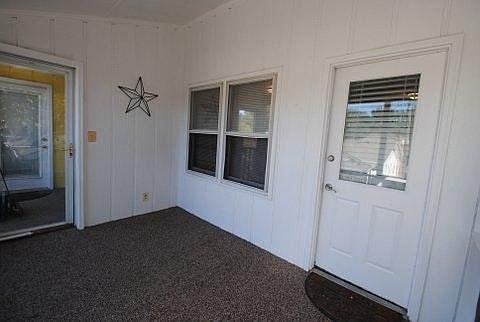 new paint and carpet in 2nd floor screened-in porch