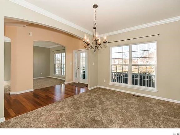 Another view of the dining room, entry and living room.