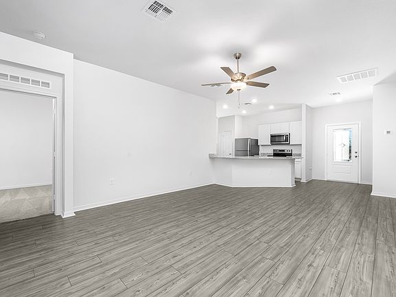 Spacious family room with vinyl flooring