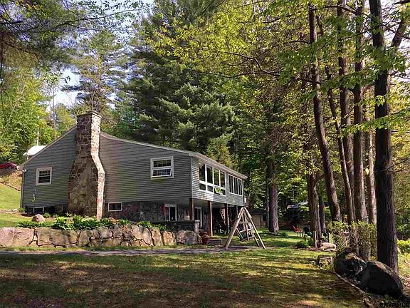 Level, front lawn overlooks lake.