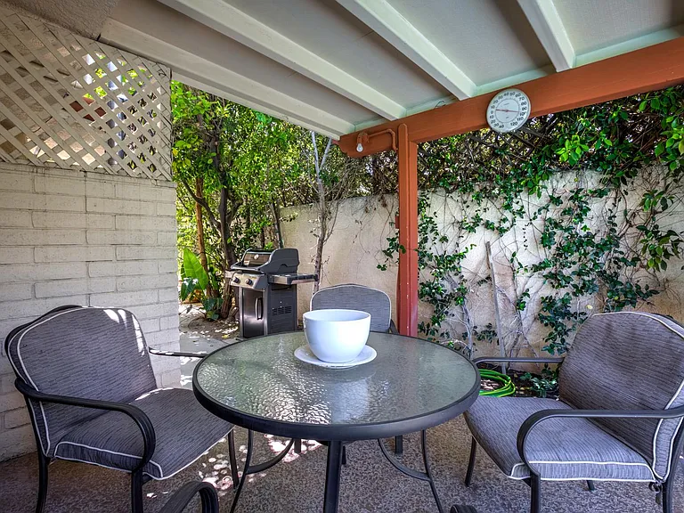 Breakfast area with view to BBQ.