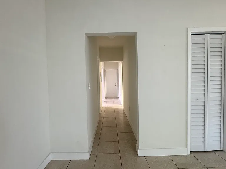 Hallway to bedroom and kitchen area