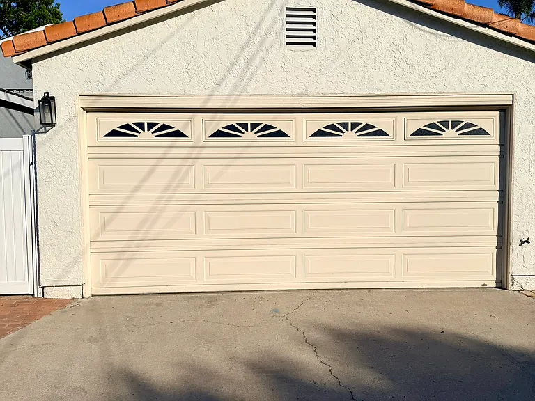 Two-car garage and alley parking spot.