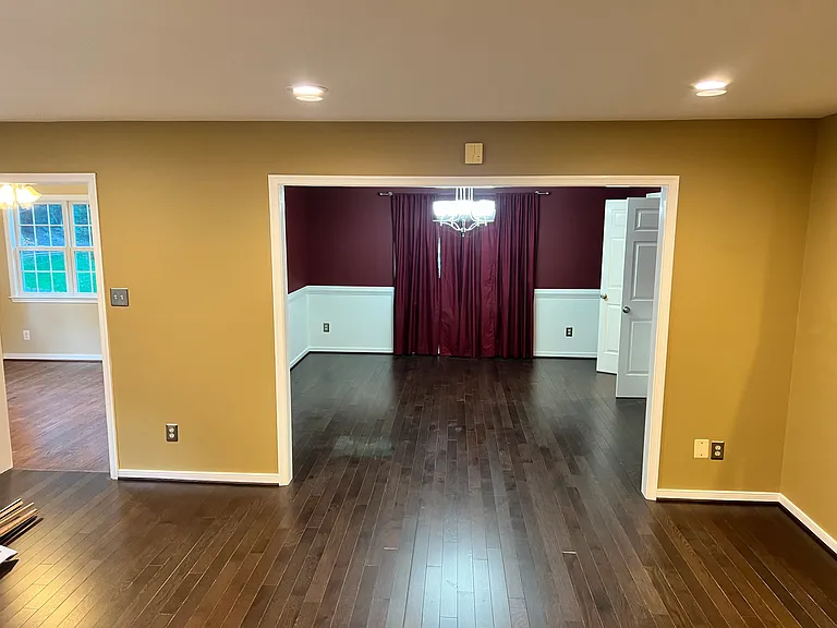 View into the dining room from the family room. Dining room walls have been repainted to neutral colors (see next photo). Doorway on the left leads to sun room.