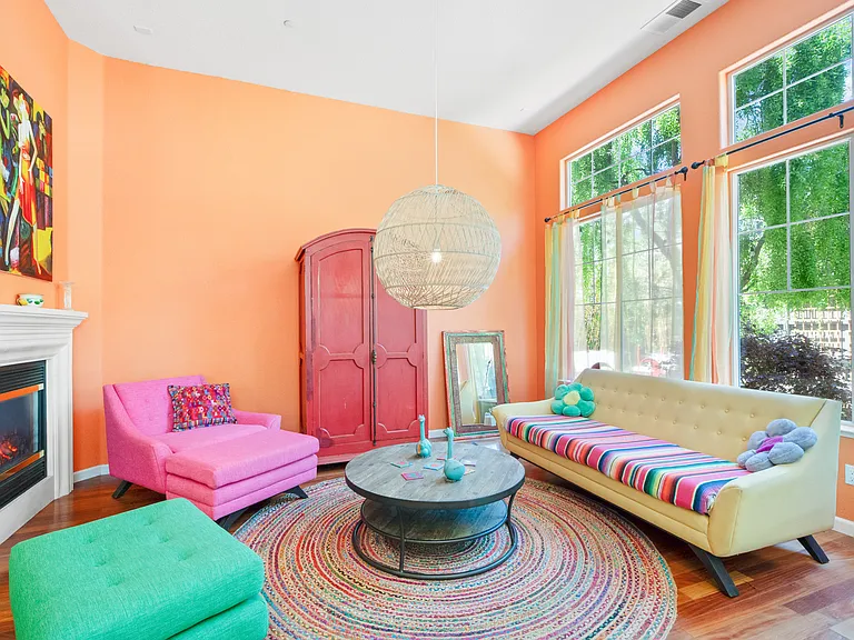 Family Room with fireplace and huge windows overlooking the backyard