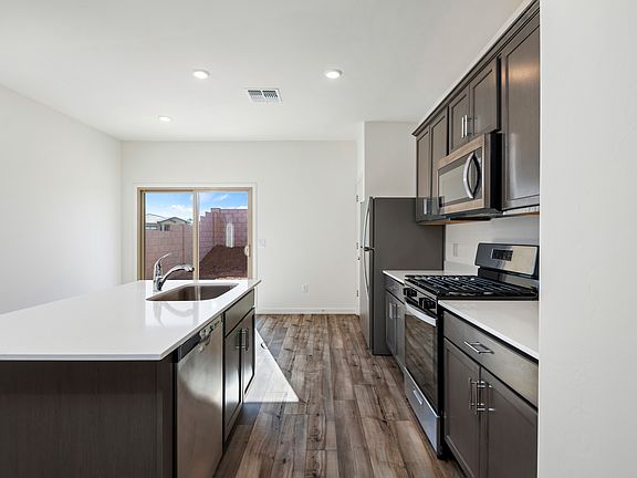 The kitchen comes with a full suite of stainless steel appliances!